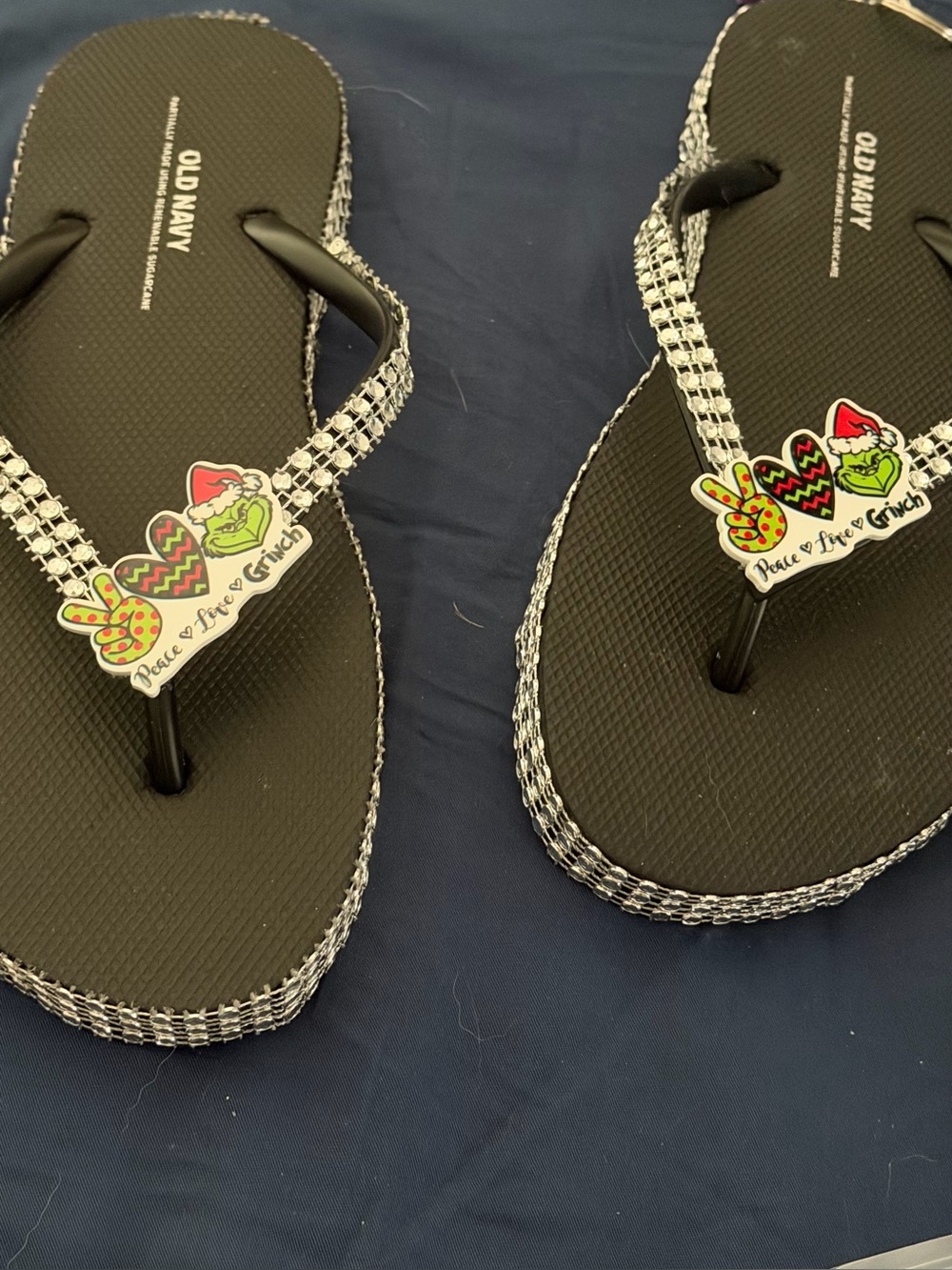 Old Navy Black Flip Flops with Rhinestone Straps and Grinch Charm